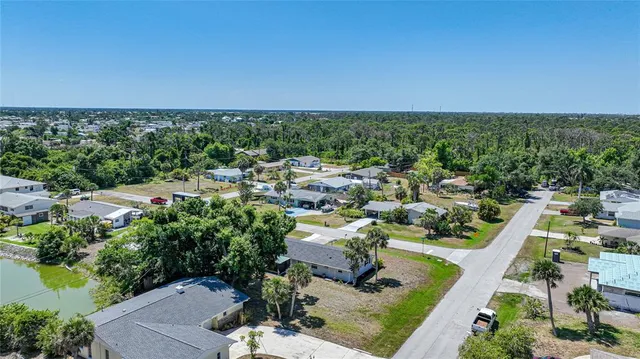an aerial view of a house with a garden