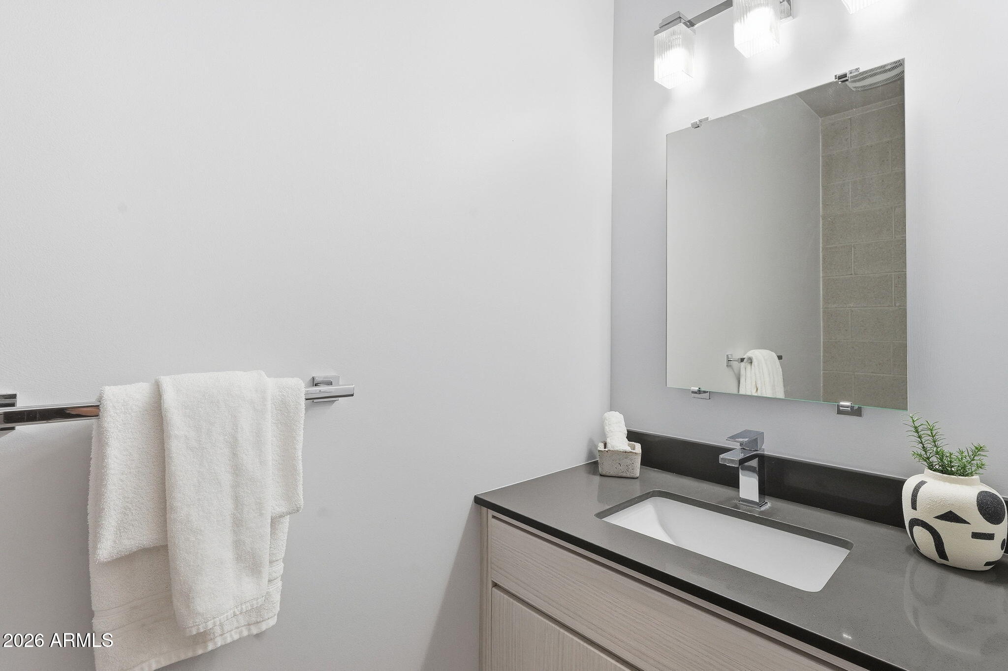 2727 East Thomas Road, Unit 5 Phoenix, AZ 85016 - Photo 29 of 41 a bathroom with a granite countertop sink and a mirror