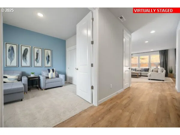 a view of a livingroom with furniture and a ceiling fan