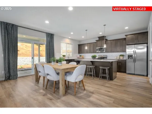 a dining room with furniture and wooden floor