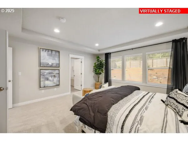 a spacious bedroom with a large bed and a window