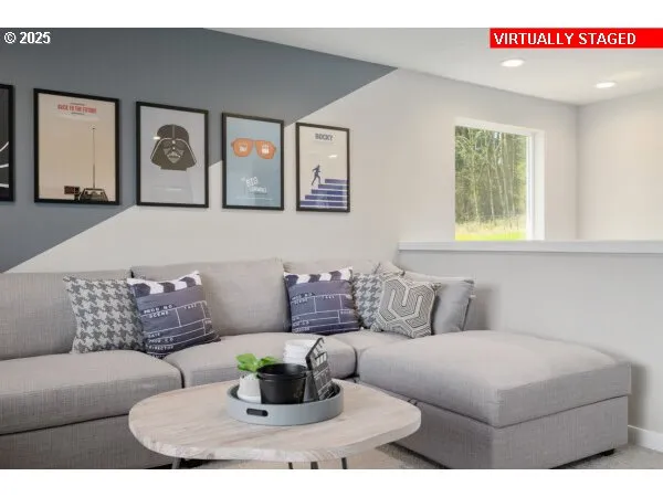 a living room with furniture and painting on the wall