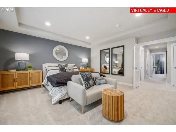 a living room with a bed furniture and a large mirror