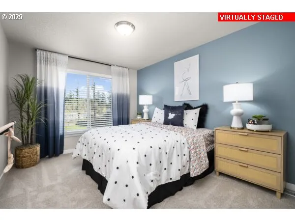 a bedroom with a bed and a night stand