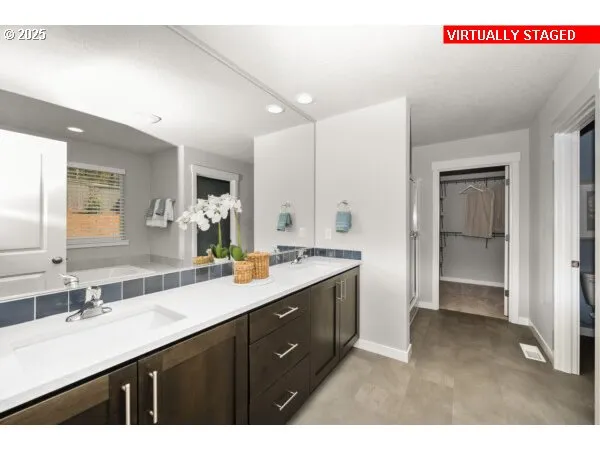 a bathroom with a sink a mirror and a shower