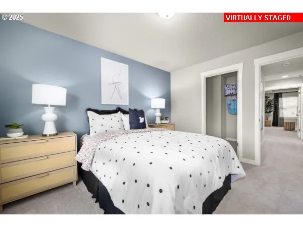 a bedroom with a bed and a night stand