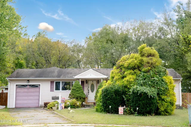 a front view of a house with yard