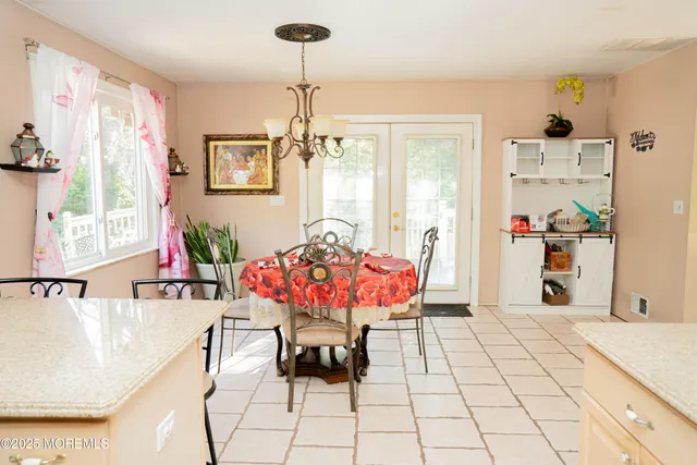 a kitchen with a refrigerator and a stove