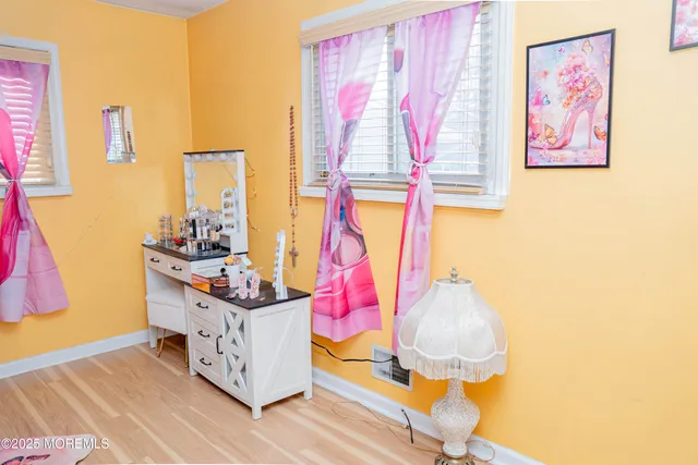 a room filled with furniture and a wooden floor