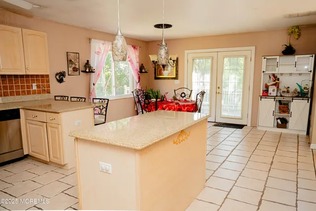 a kitchen with stainless steel appliances a stove a sink and a refrigerator