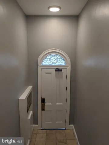 an empty room with wooden door