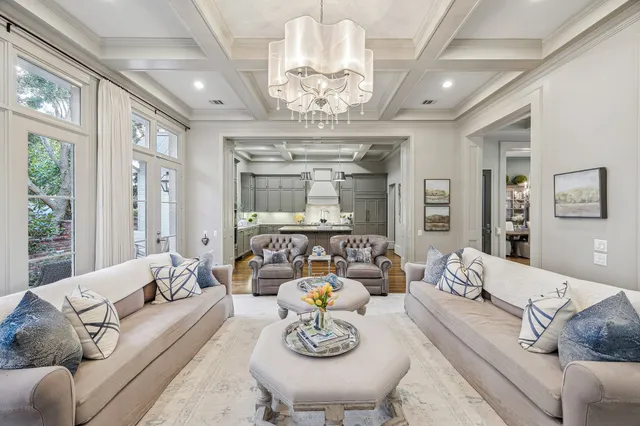 a living room with furniture chandelier and a chandelier
