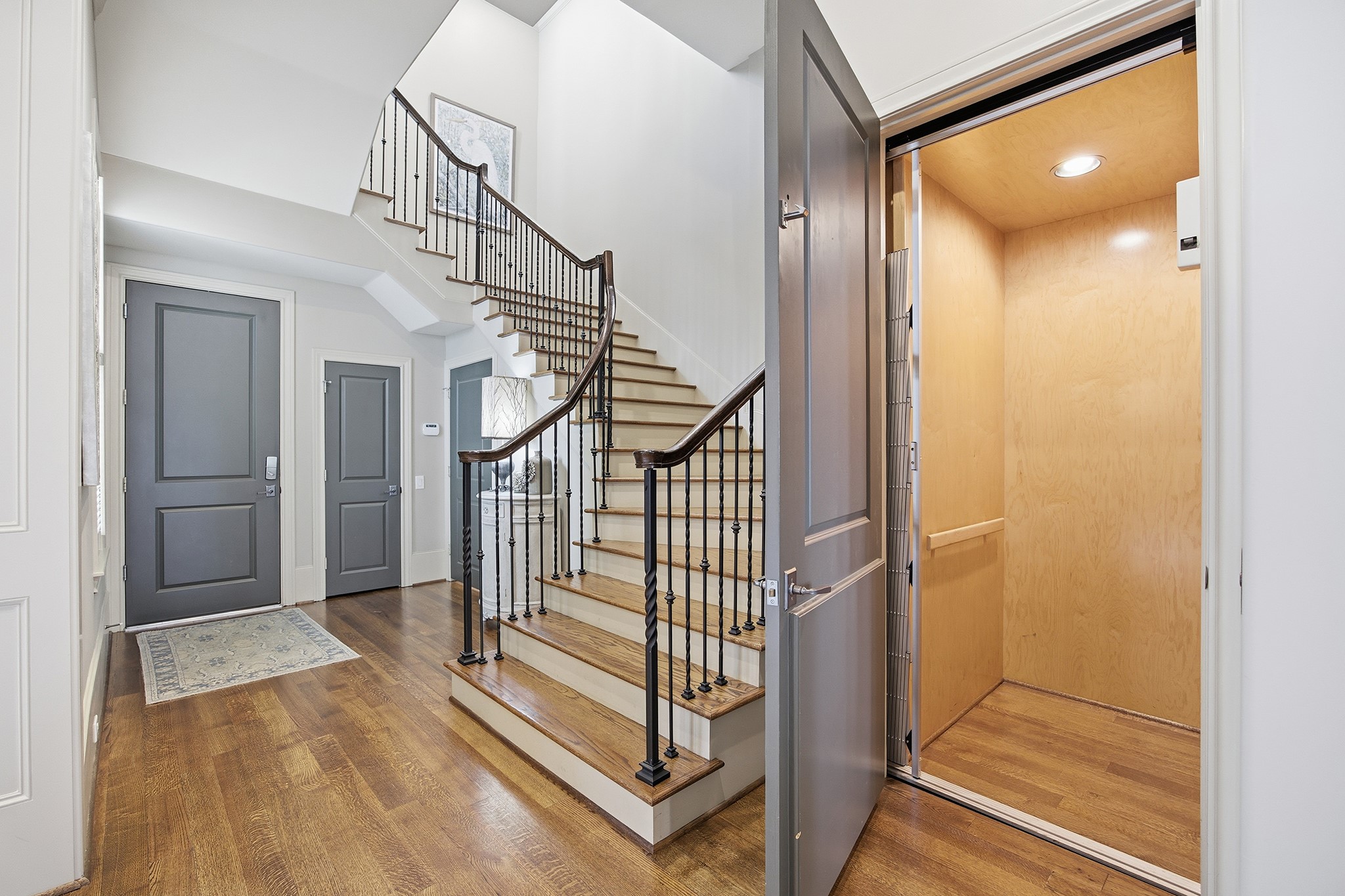3240 Bammel Lane Houston, TX 77098 - Photo 18 of 34 a view of entryway and hall with wooden floor