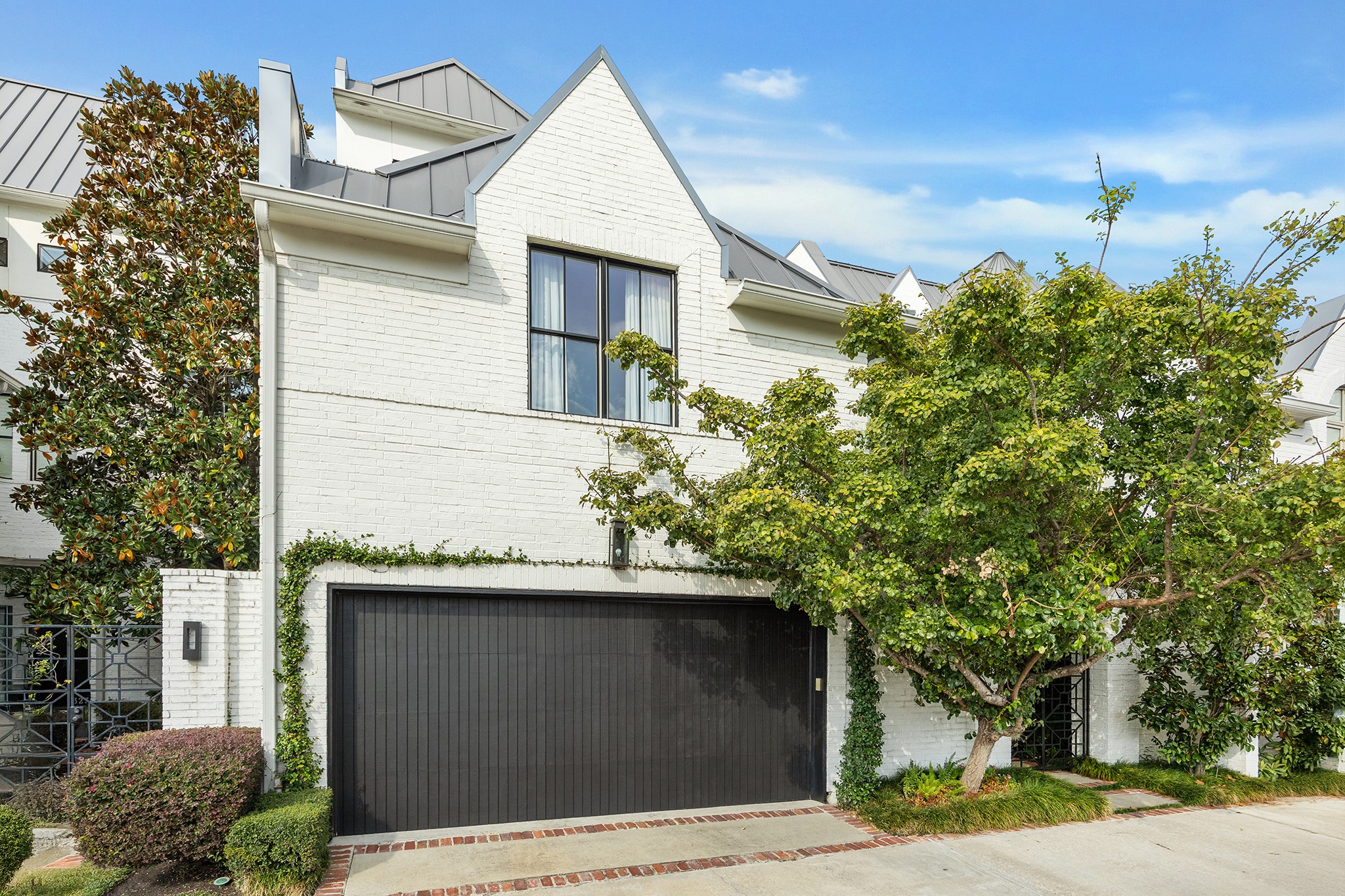 3240 Bammel Lane Houston, TX 77098 - Photo 2 of 34 a front view of a house with garden