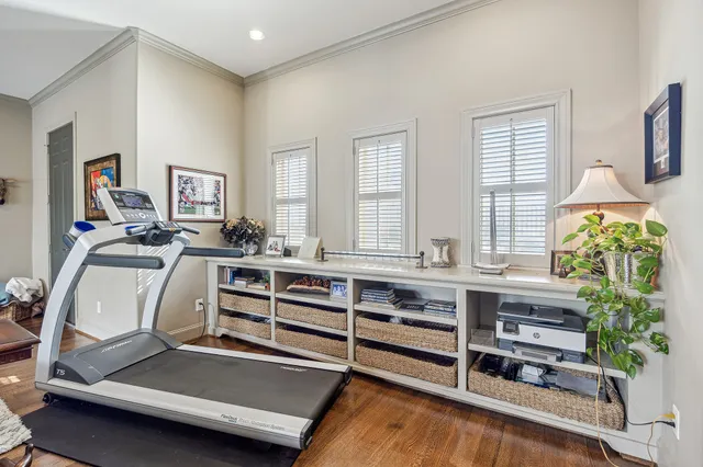 a bedroom with two beds and a window