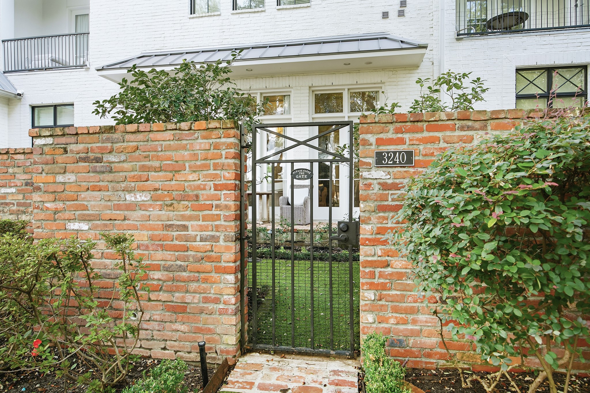 3240 Bammel Lane Houston, TX 77098 - Photo 34 of 34 a view of a brick house with a large windows