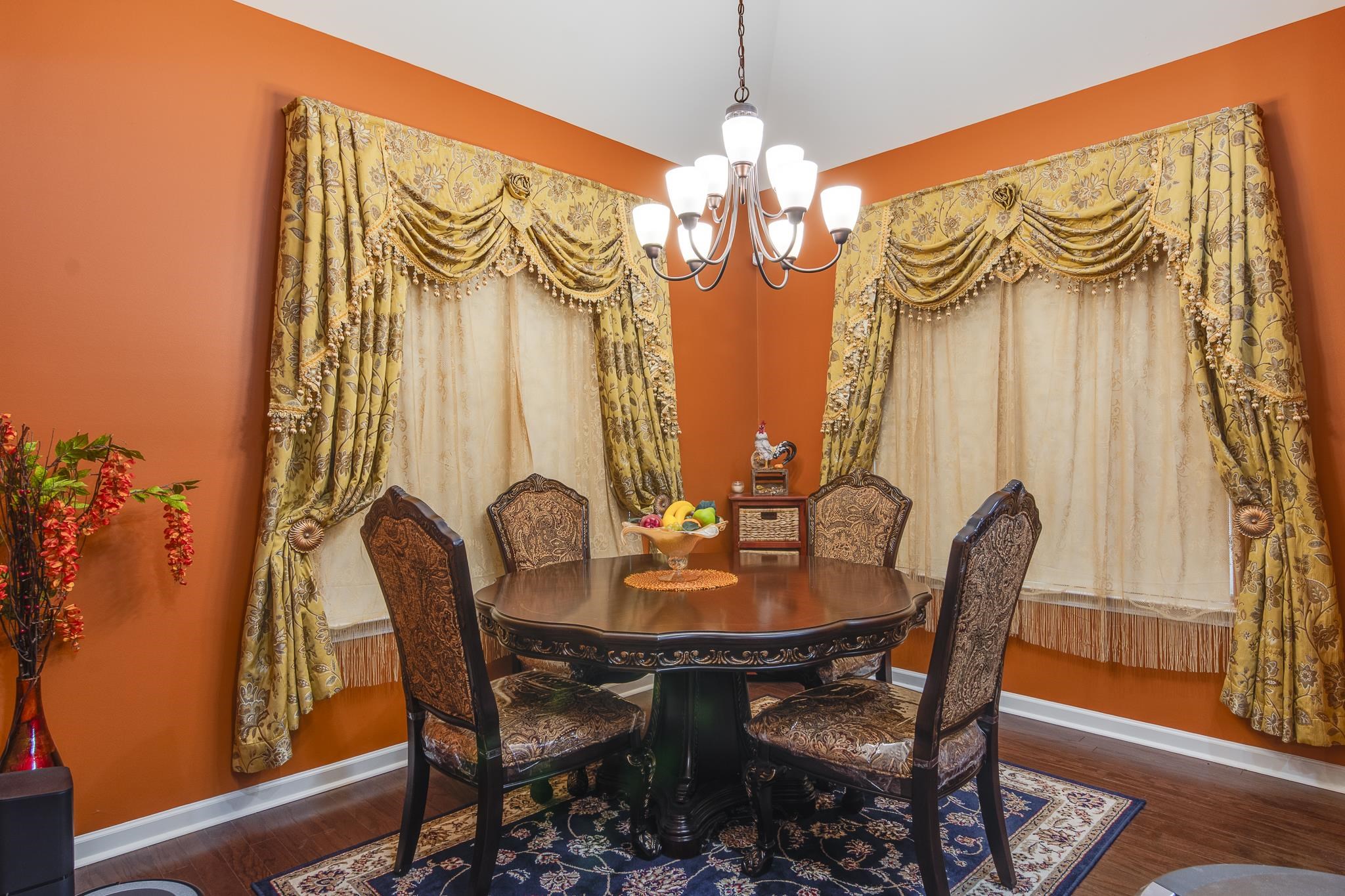 135 Chesnut Rdg Drive Oakland, TN 38060 - Photo 9 of 36 Dining area featuring hanging lights and dark wood-style floors