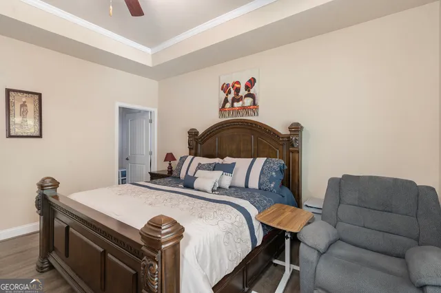 a bedroom with a bed and a couch