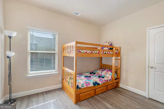 a children room with toys and dresser