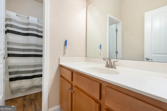 a bathroom with a sink and a mirror