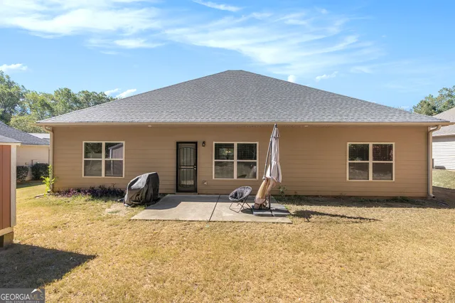 a house with yard in front of it