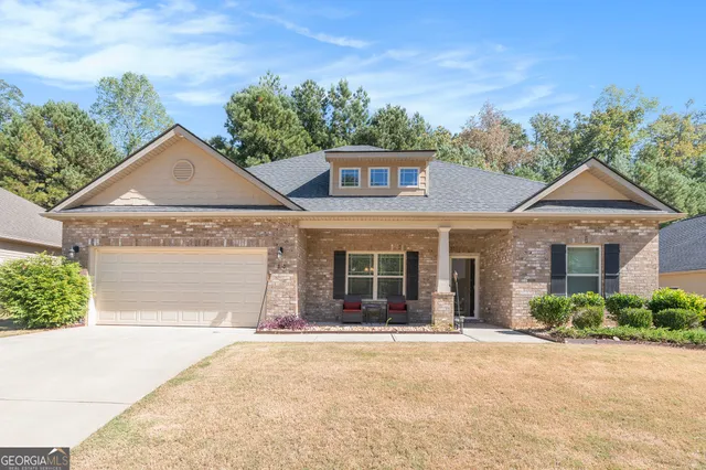 front view of a house with a yard