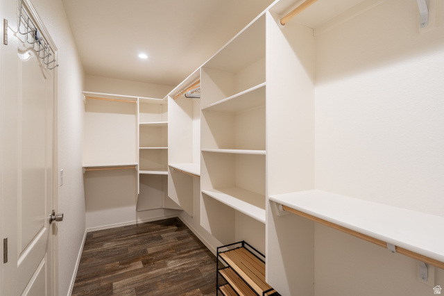 700 East Peter Springs Road Monticello, UT 84535 - Photo 24 of 57 Spacious walk-in closet featuring white built-in shelving, hanging rods, recessed lighting, and wood-finish flooring