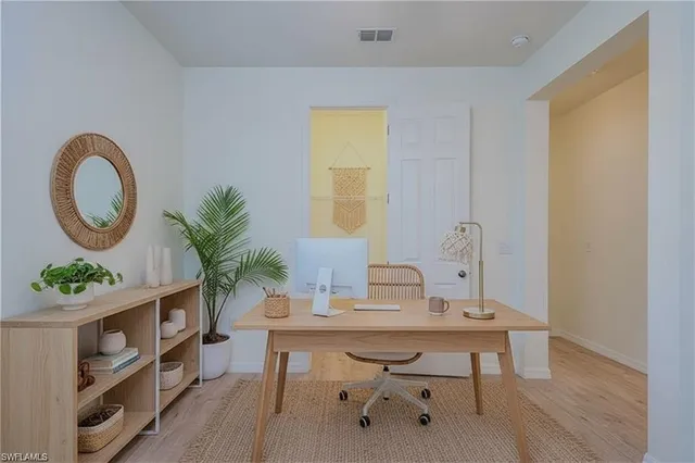 a workspace with furniture and a wooden floor