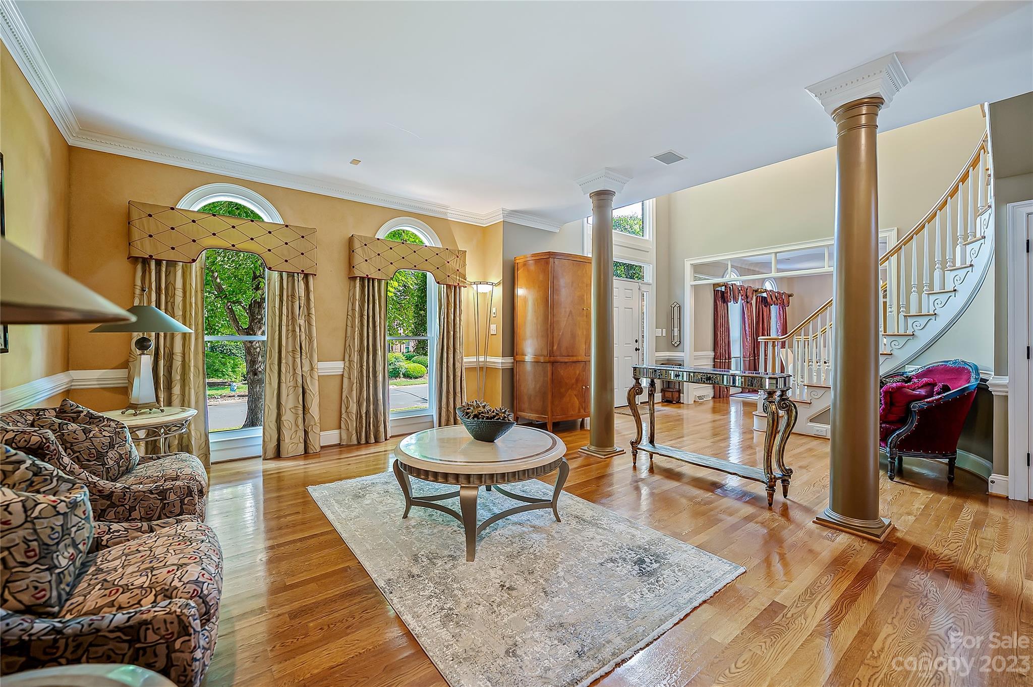 4517 Binfords Ridge Road Charlotte, NC 28226 - Photo 11 of 47 a living room with furniture and a floor to ceiling window