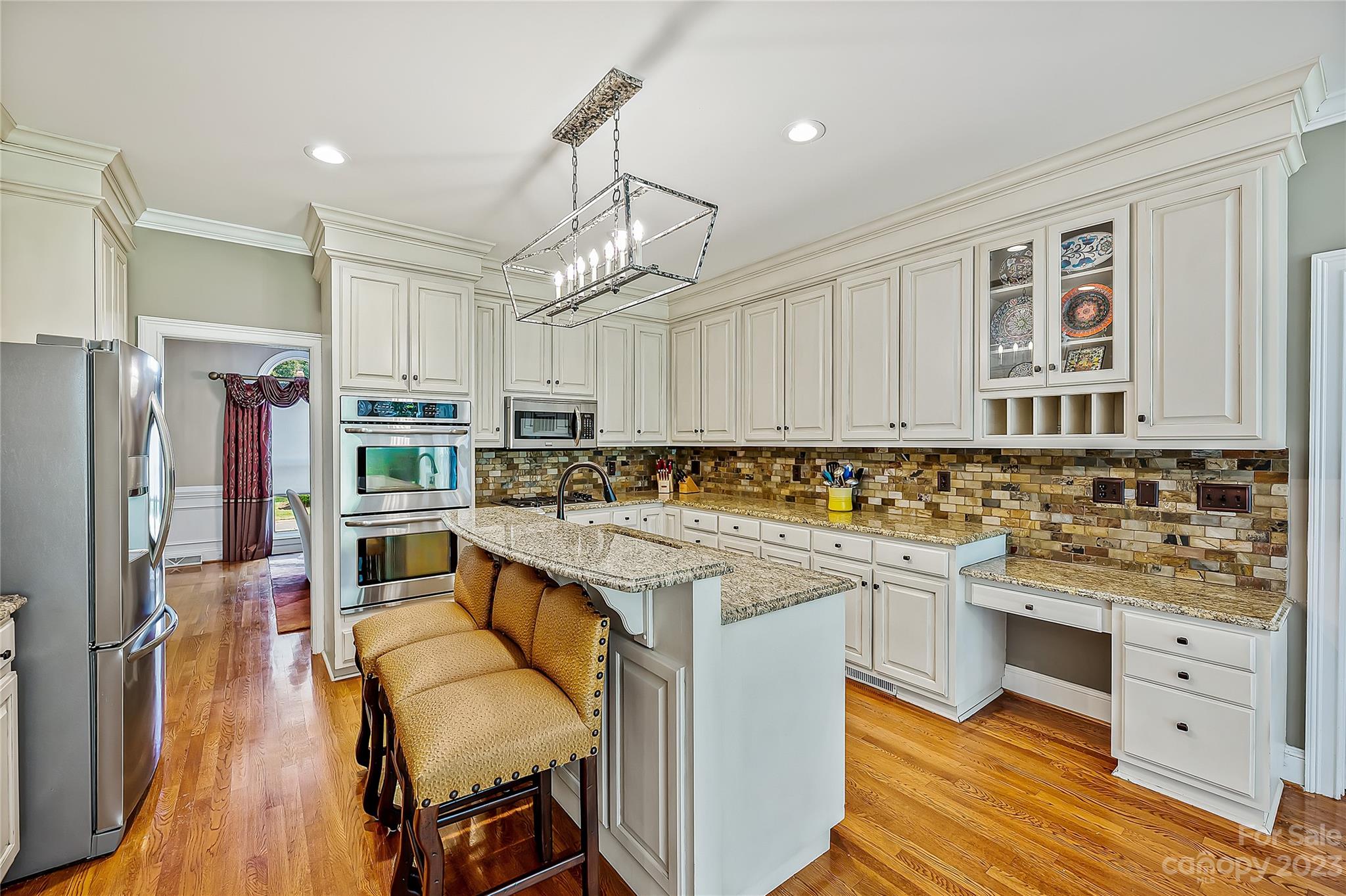 4517 Binfords Ridge Road Charlotte, NC 28226 - Photo 17 of 47 a kitchen with a sink stove and cabinets