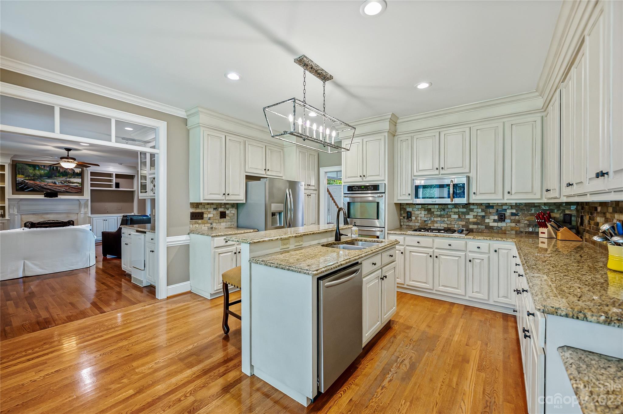 4517 Binfords Ridge Road Charlotte, NC 28226 - Photo 18 of 47 a kitchen with stainless steel appliances granite countertop a stove oven and a refrigerator