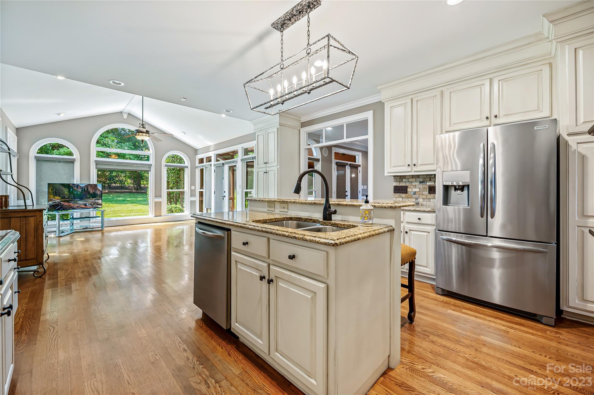 4517 Binfords Ridge Road Charlotte, NC 28226 - Photo 19 of 47 a kitchen with stainless steel appliances granite countertop a refrigerator a stove and a wooden floors