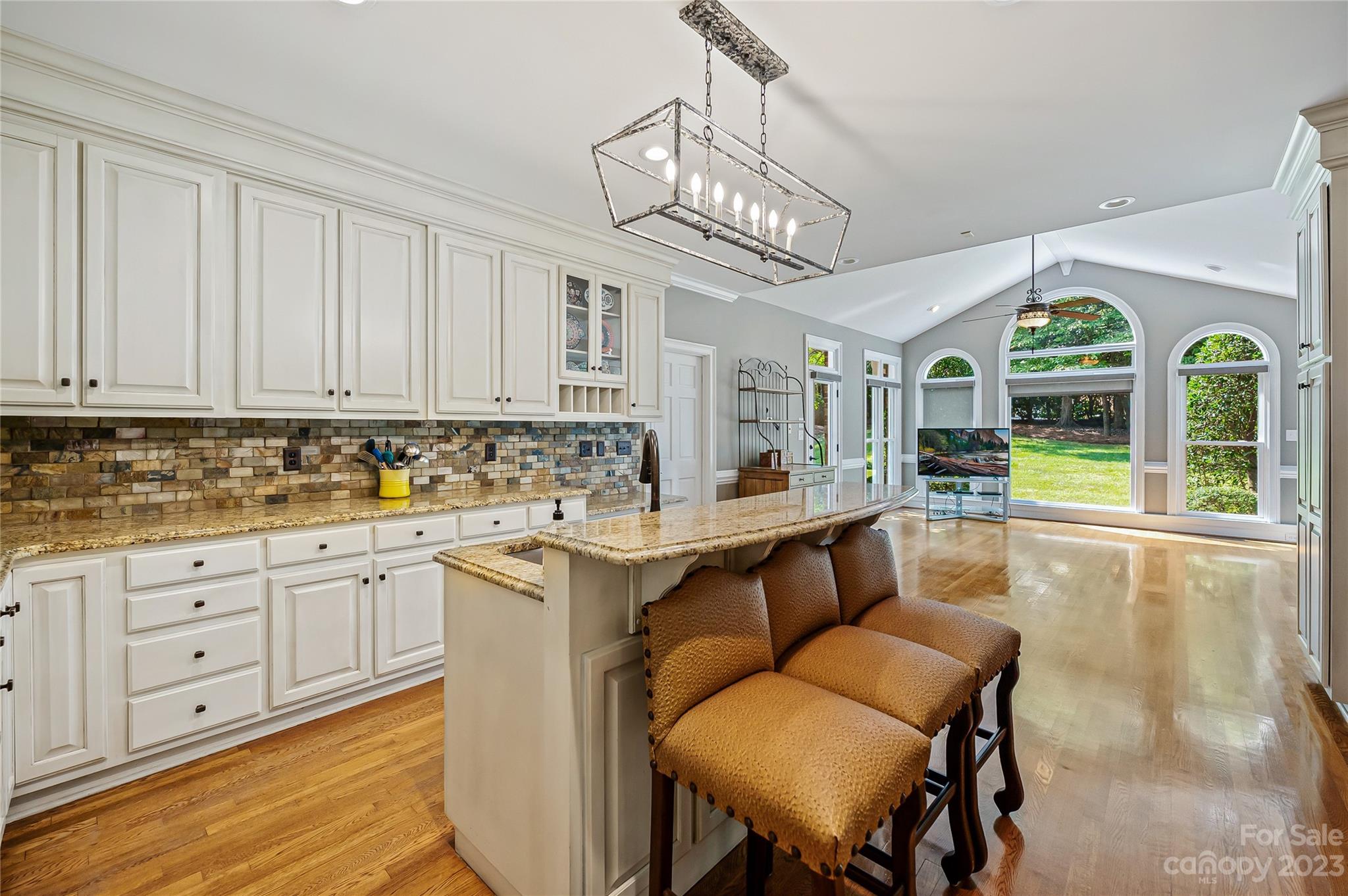 4517 Binfords Ridge Road Charlotte, NC 28226 - Photo 20 of 47 a view of a kitchen area with furniture and wooden floor