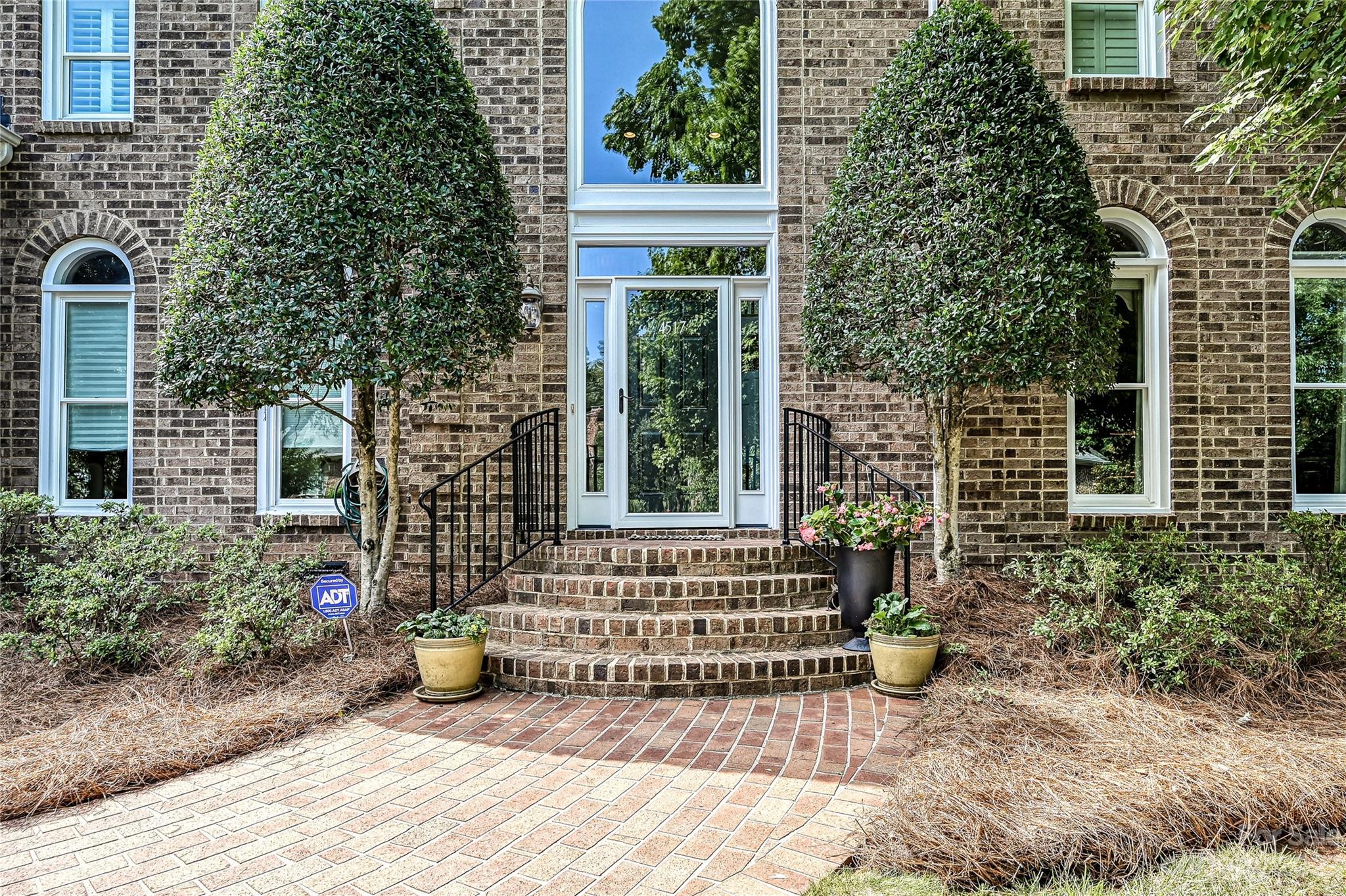 4517 Binfords Ridge Road Charlotte, NC 28226 - Photo 2 of 47 a view of a house with a small yard and plants
