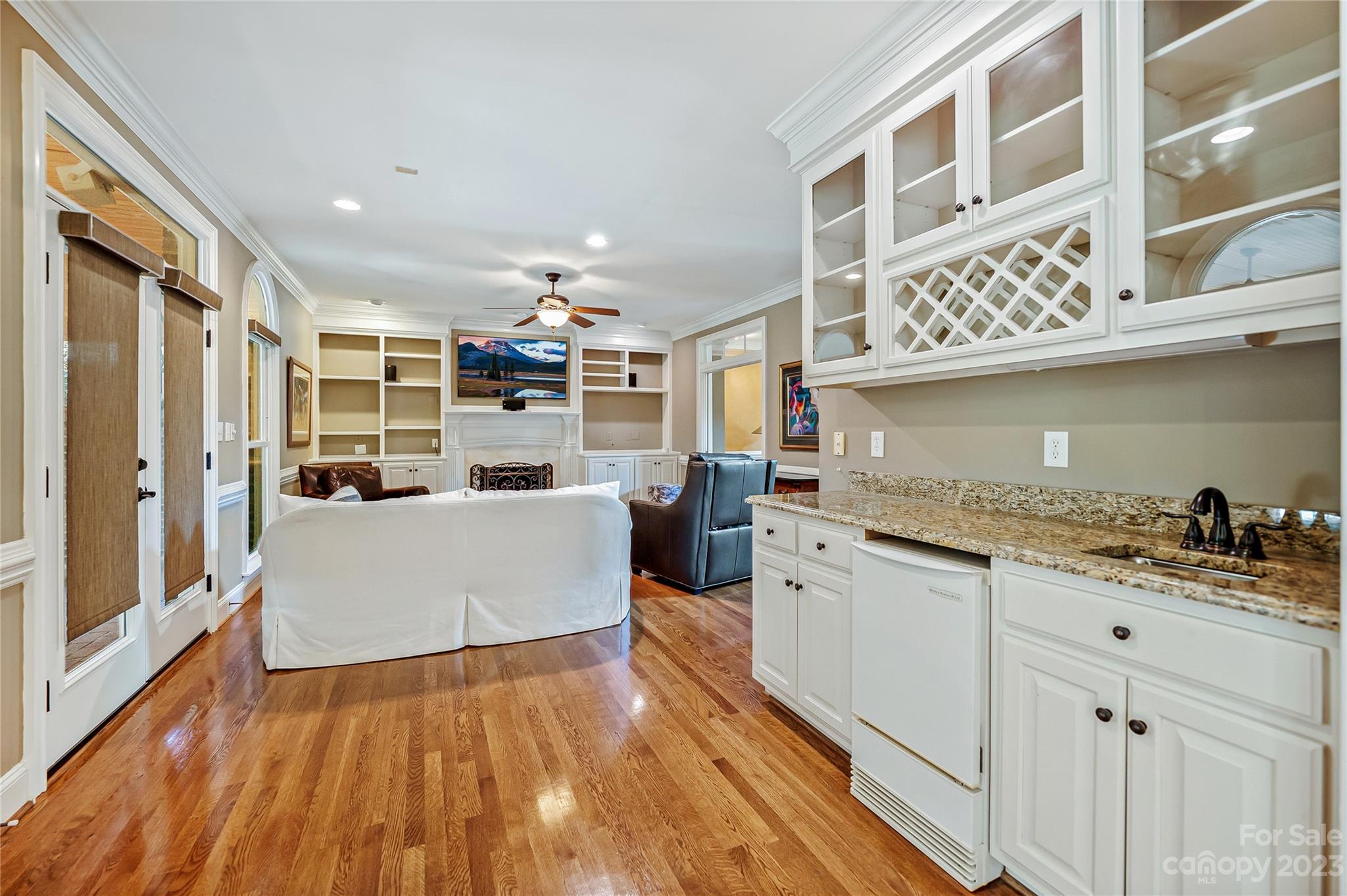 4517 Binfords Ridge Road Charlotte, NC 28226 - Photo 22 of 47 a large white kitchen with stainless steel appliances granite countertop a stove and a wooden floors