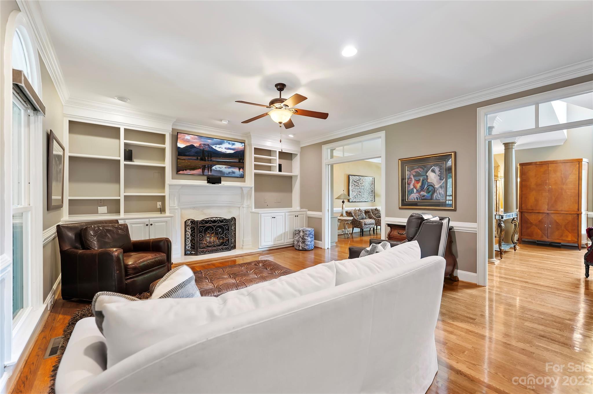 4517 Binfords Ridge Road Charlotte, NC 28226 - Photo 23 of 47 a living room with furniture a fireplace and a flat screen tv