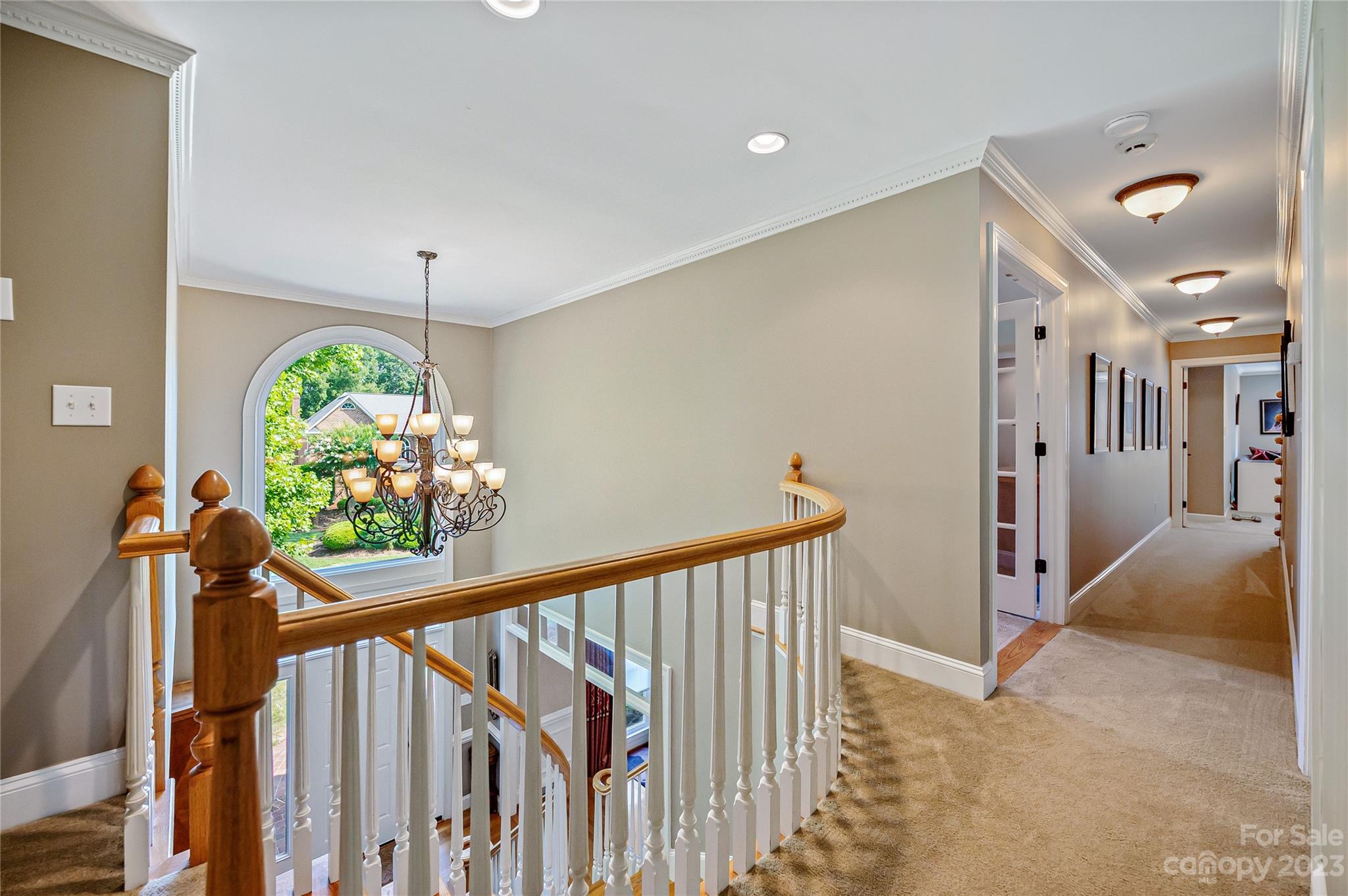 4517 Binfords Ridge Road Charlotte, NC 28226 - Photo 25 of 47 a view of a hallway with wooden floor stairs
