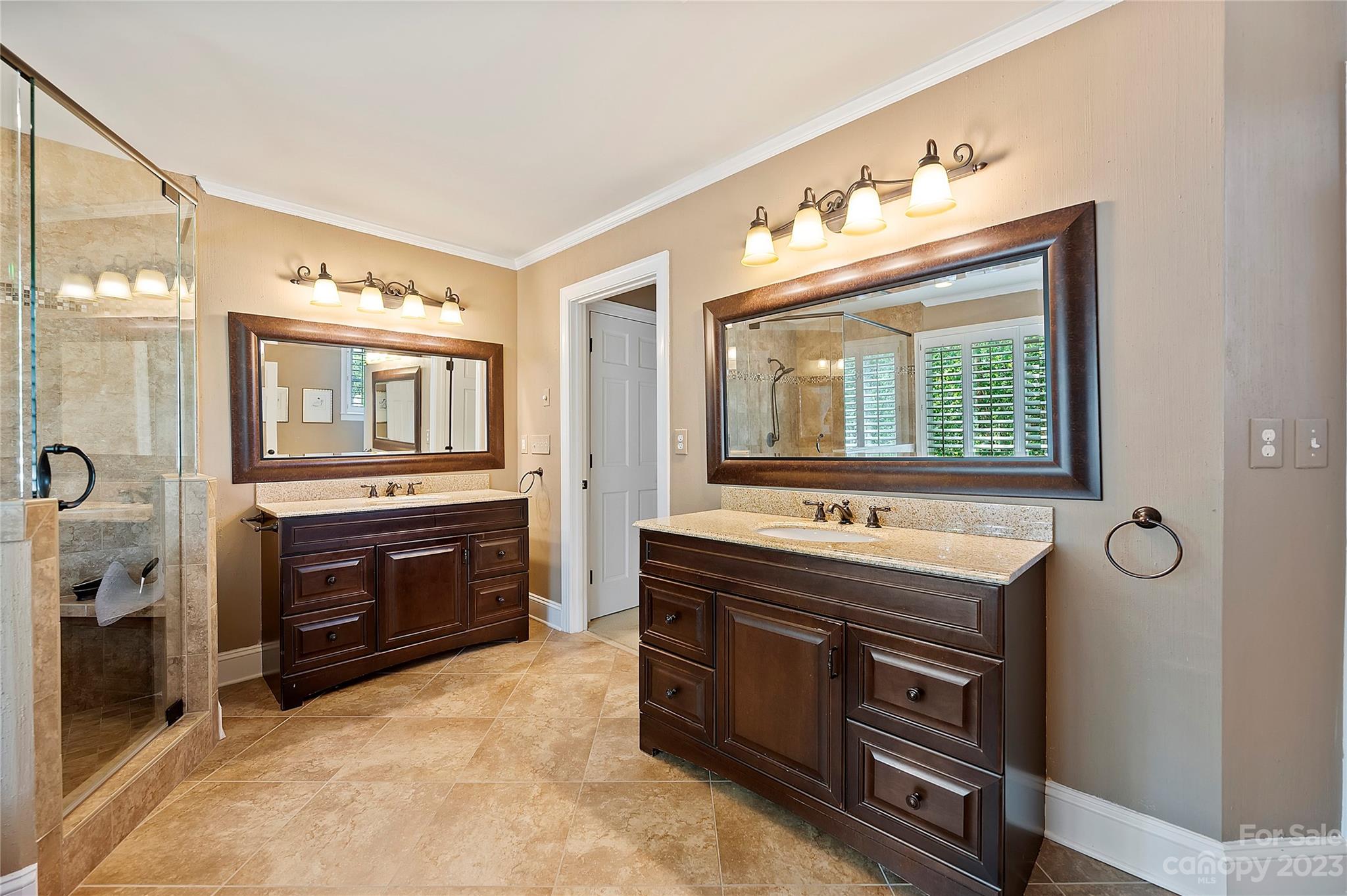 4517 Binfords Ridge Road Charlotte, NC 28226 - Photo 30 of 47 a bathroom with a sink double vanity and a mirror