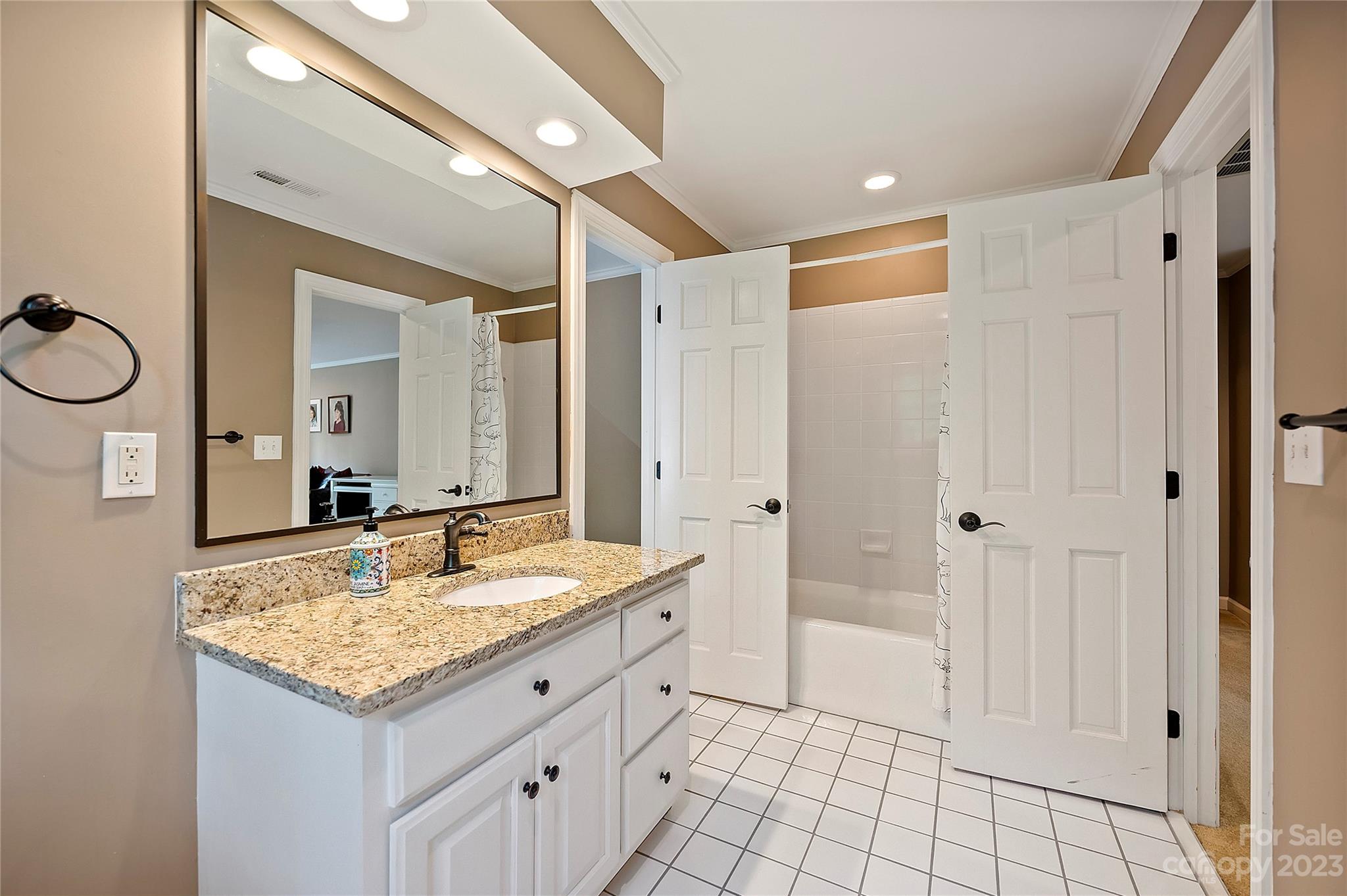 4517 Binfords Ridge Road Charlotte, NC 28226 - Photo 37 of 47 a bathroom with a granite countertop sink and a mirror