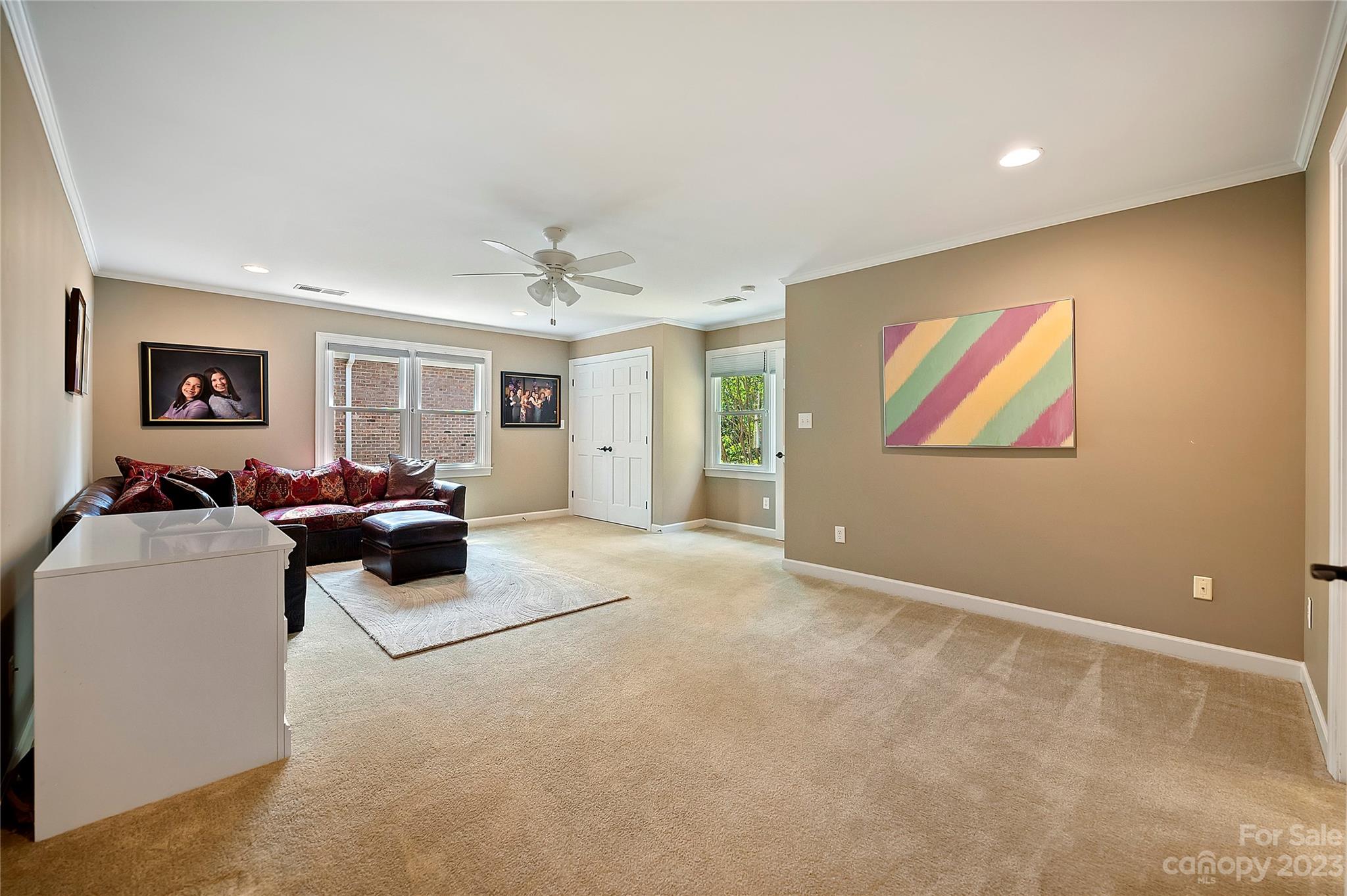 4517 Binfords Ridge Road Charlotte, NC 28226 - Photo 38 of 47 a living room with furniture a window and a bookshelf