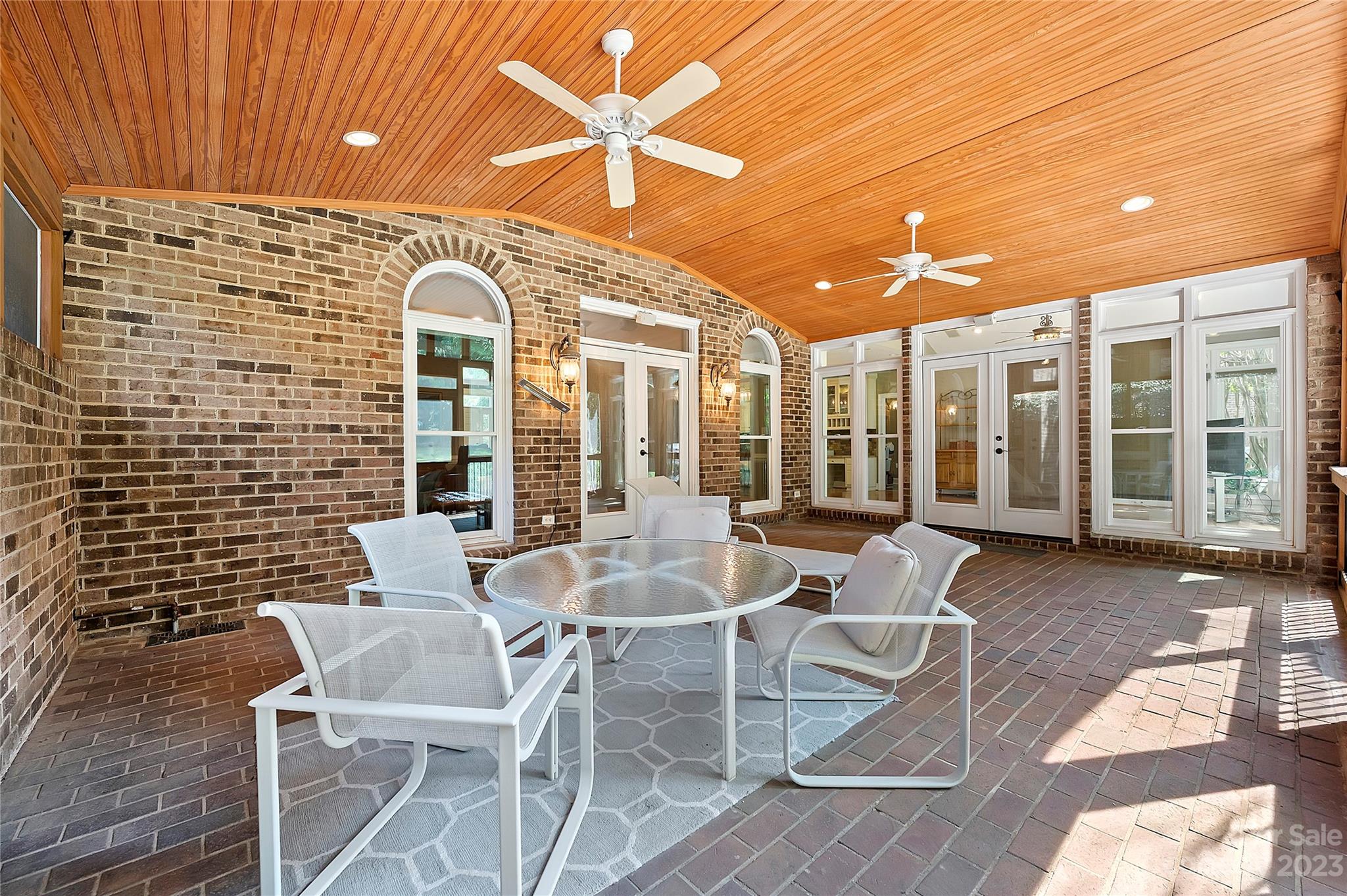 4517 Binfords Ridge Road Charlotte, NC 28226 - Photo 41 of 47 a view of a patio with a table and chairs and potted plants