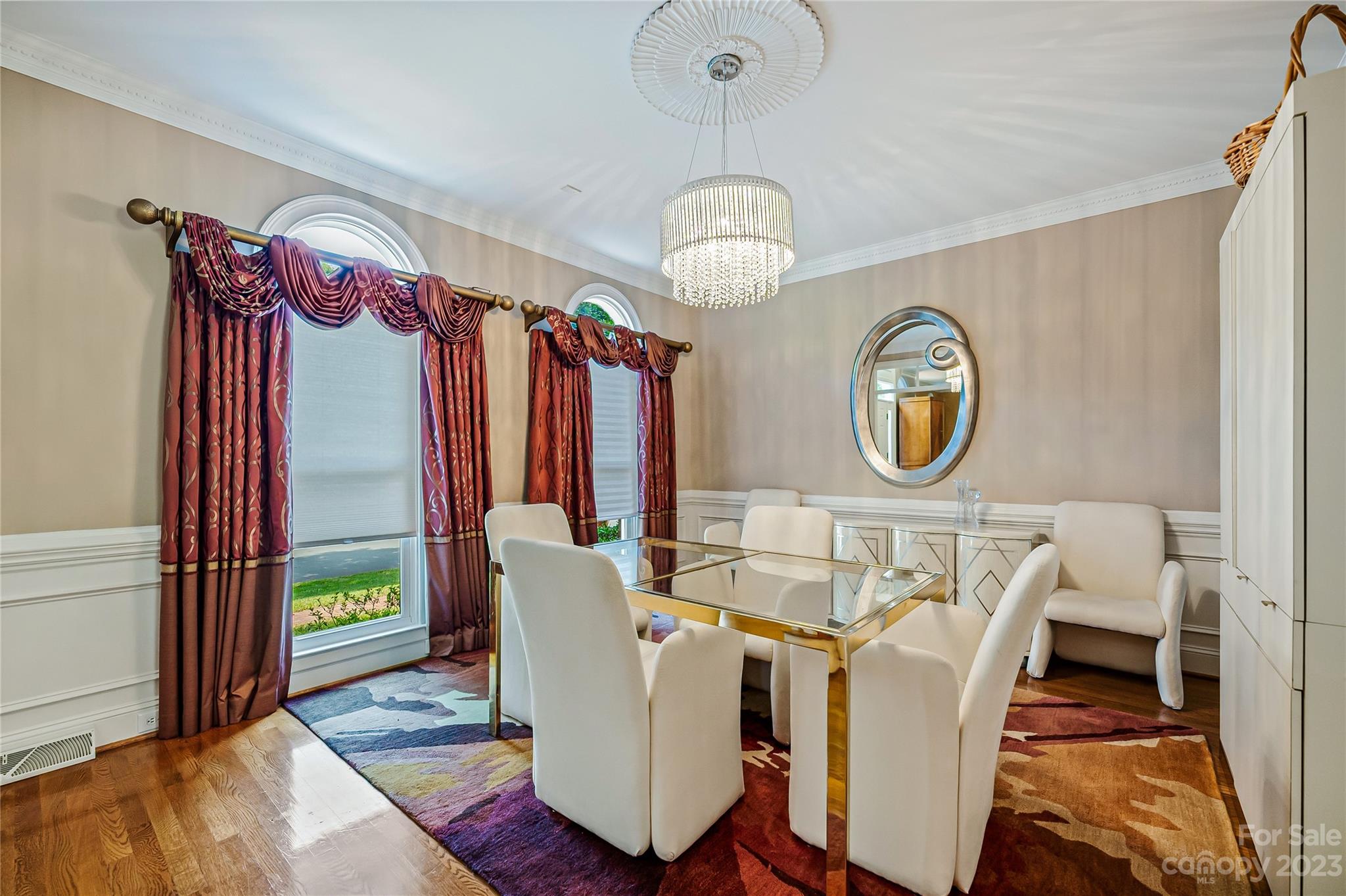 4517 Binfords Ridge Road Charlotte, NC 28226 - Photo 7 of 47 a view of a dining room with furniture a chandelier and wooden floor