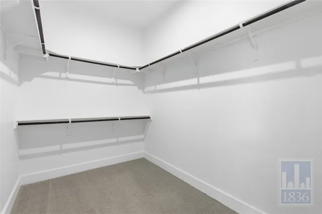 a view of an empty walk in closet
