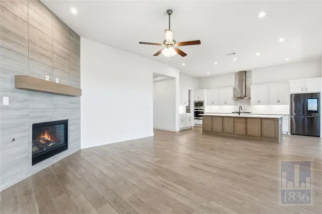 a view of kitchen with microwave and cabinets