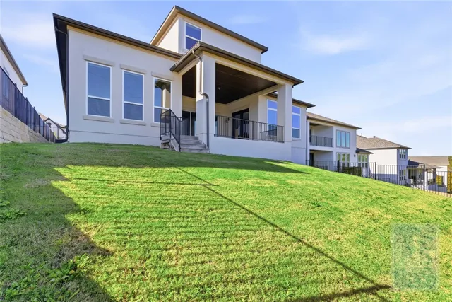 a view of house with backyard