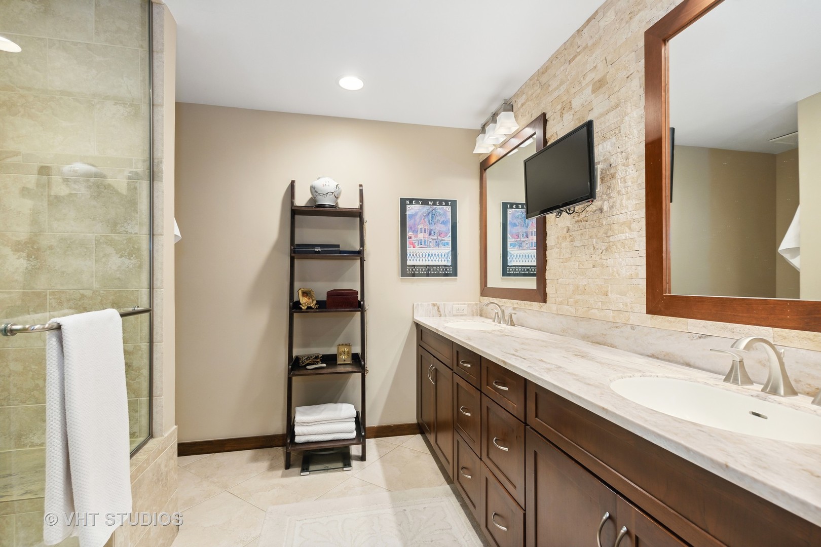 770 Valley Road Lake Forest, IL 60045 - Photo 16 of 29 a spacious bathroom with a granite countertop sink and a mirror