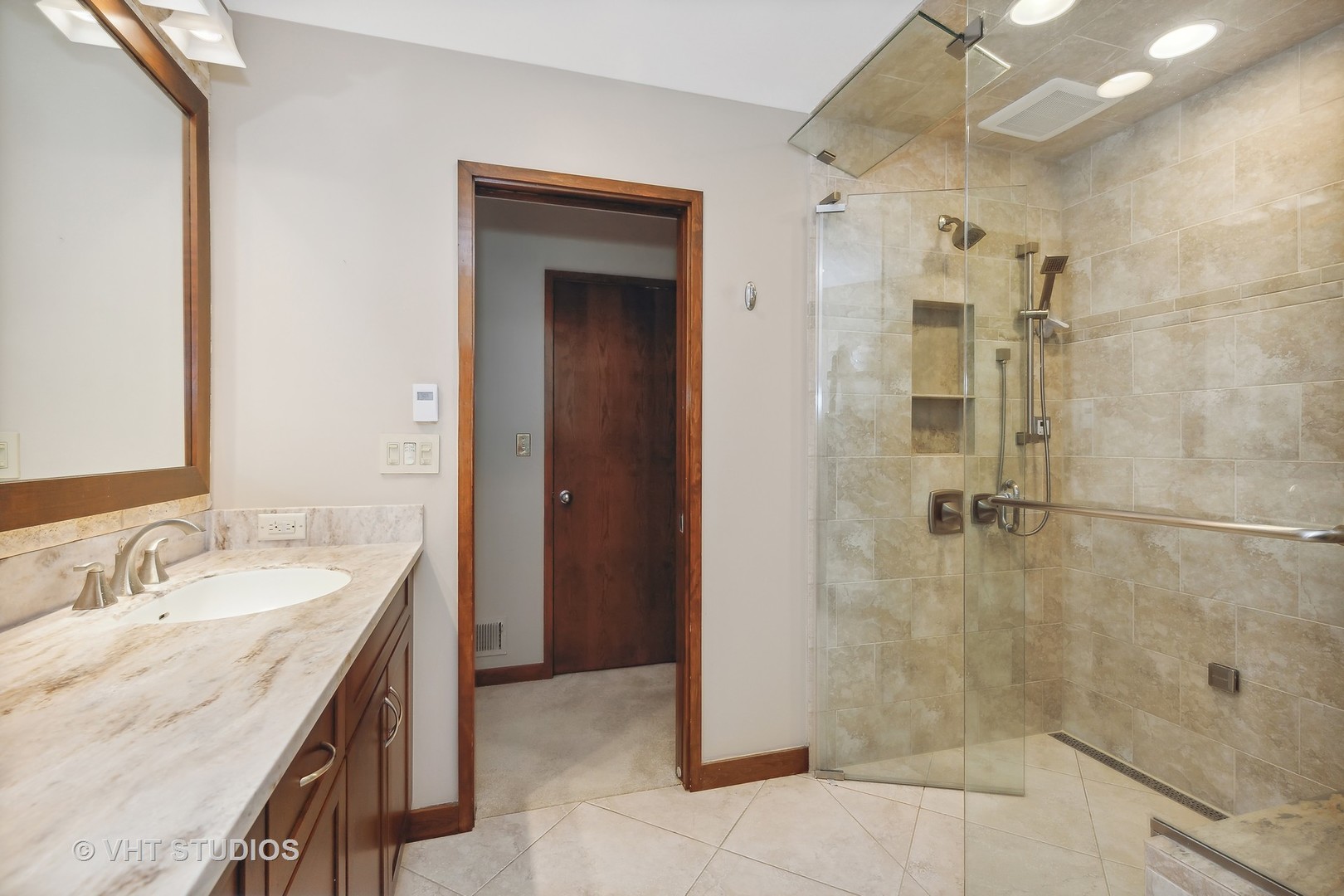 770 Valley Road Lake Forest, IL 60045 - Photo 17 of 29 a bathroom with a granite countertop shower sink and mirror