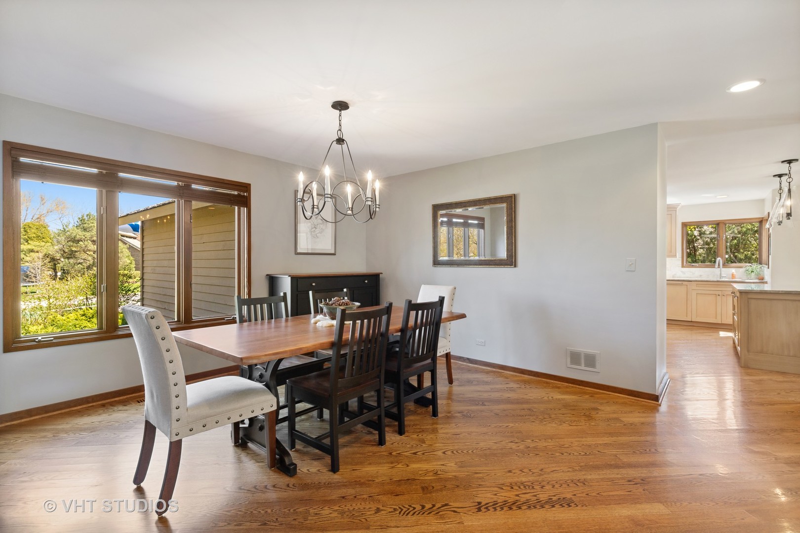 770 Valley Road Lake Forest, IL 60045 - Photo 2 of 29 a view of a dining room with furniture a chandelier and wooden floor