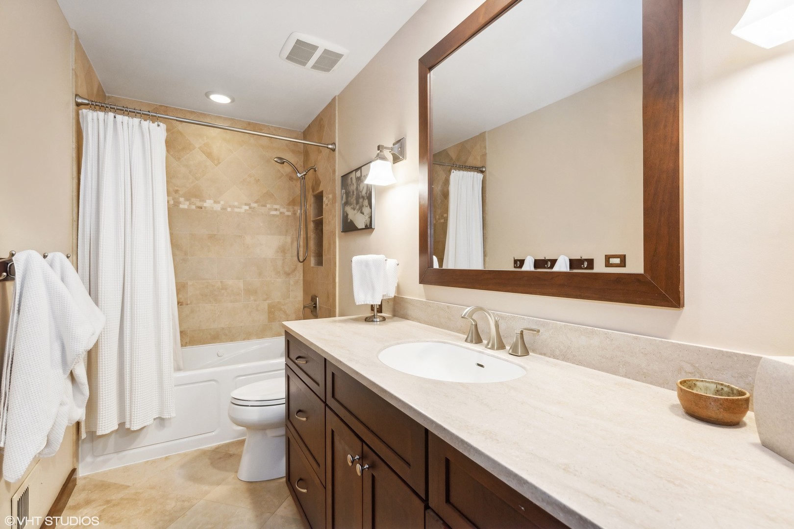 770 Valley Road Lake Forest, IL 60045 - Photo 21 of 29 a bathroom with a granite countertop sink a toilet and a bathtub