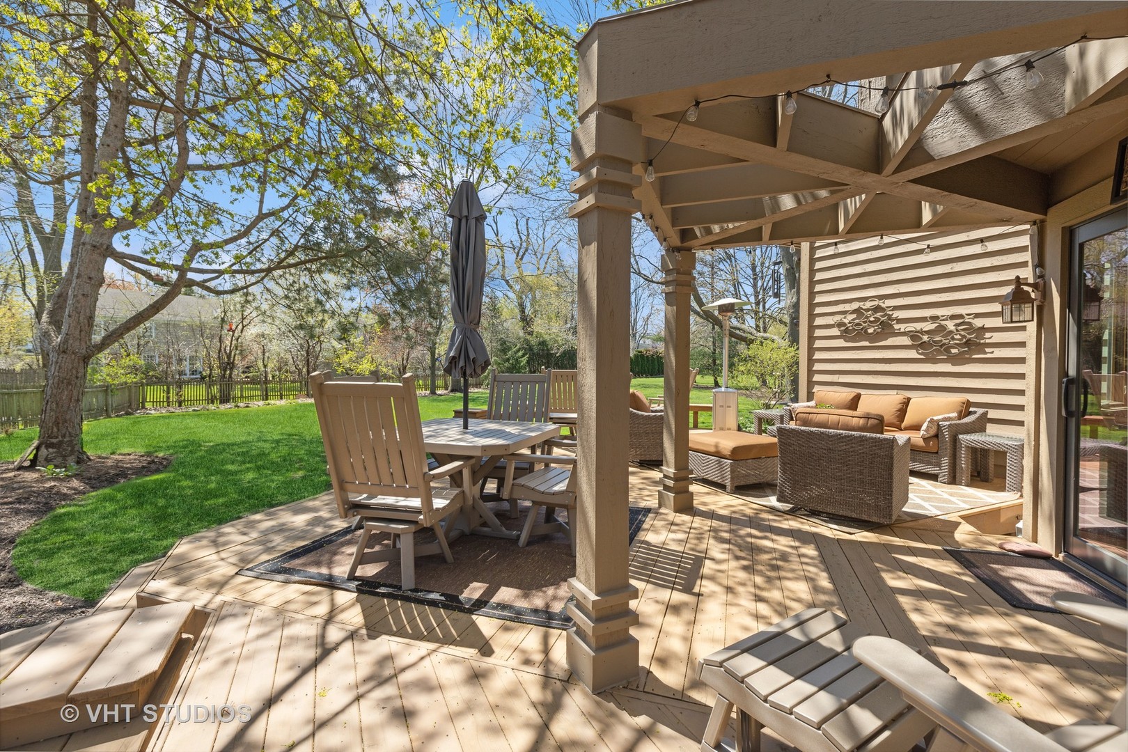 770 Valley Road Lake Forest, IL 60045 - Photo 23 of 29 a view of a patio with a dining table and chairs with a fire pit